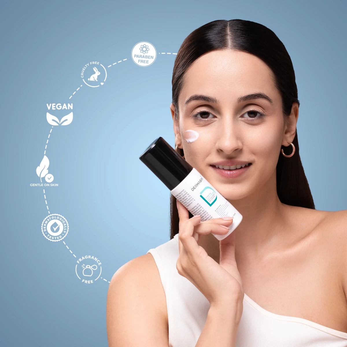 Model applying the Dermabay Hydrating Moisturizer from the Age Reversal Skincare Combo, highlighting vegan, cruelty-free, paraben-free, and dermatologically tested qualities.