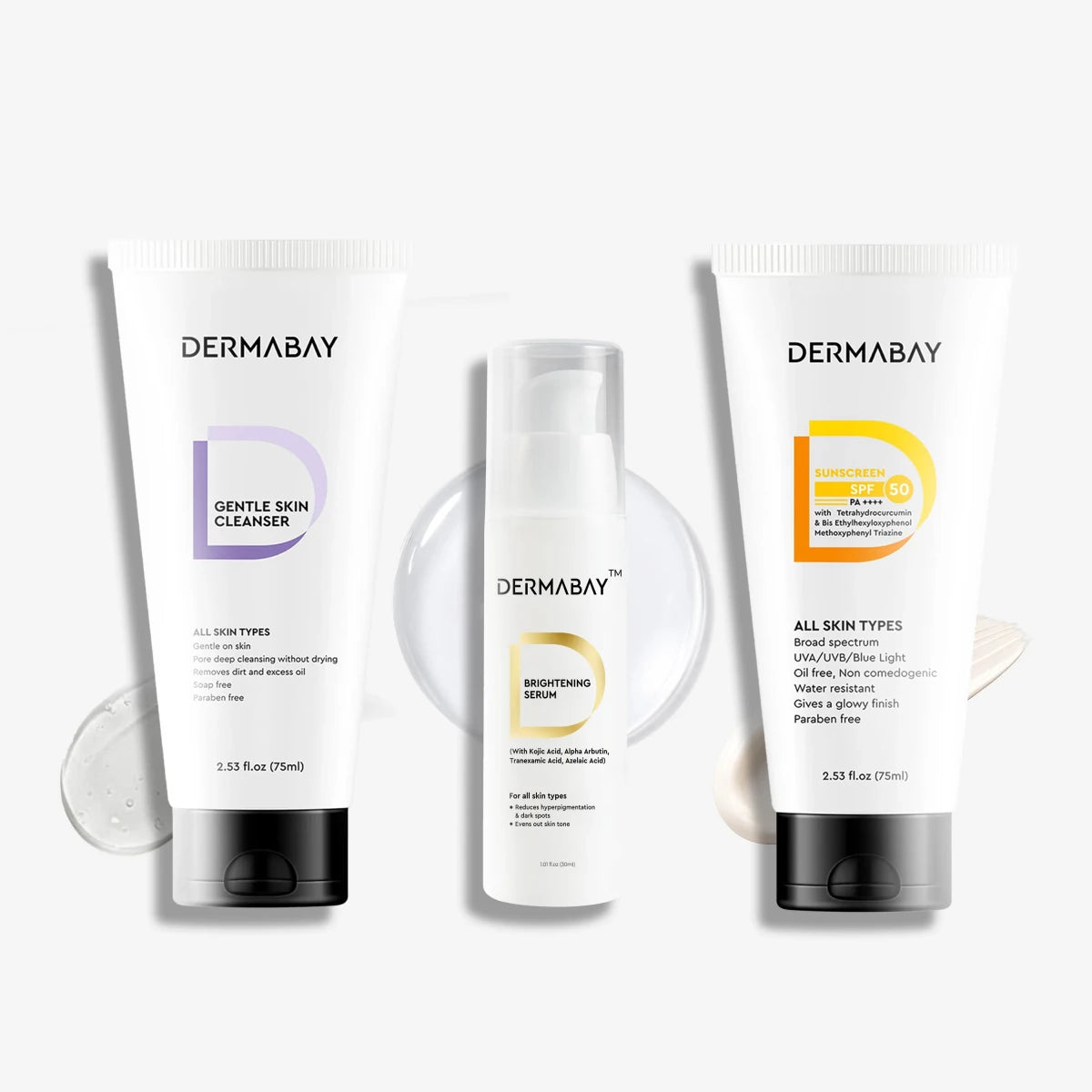 Flatlay product shot of the Dermabay Anti Pigmentation Combo featuring the Gentle Skin Cleanser, Brightening Serum, and Sunscreen SPF 50 PA++++ with texture swatches.