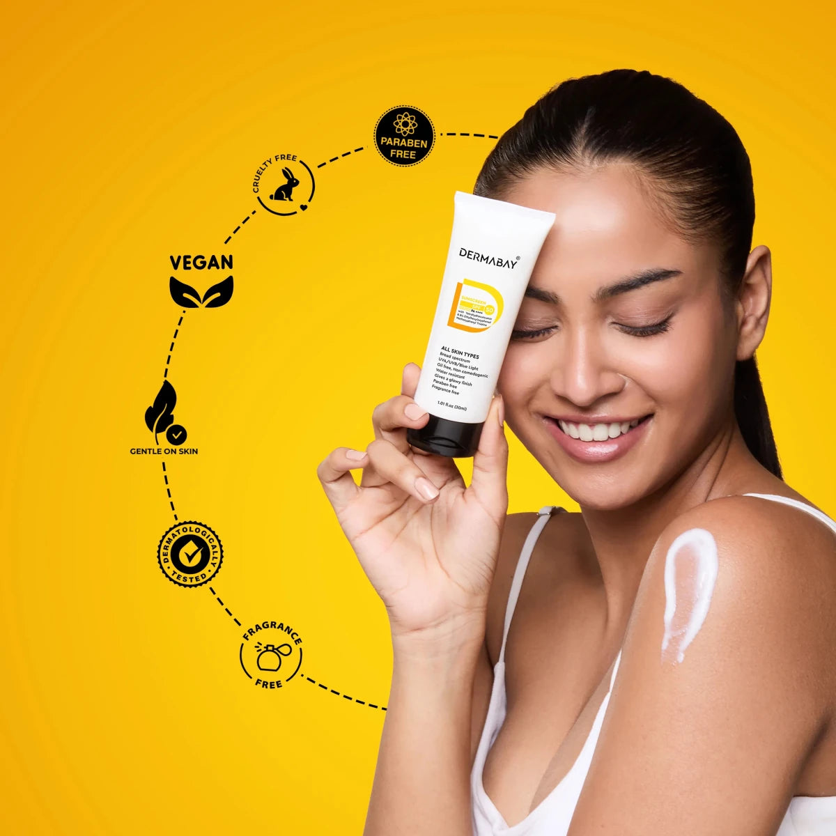 Model showcasing the Dermabay Glow And Protect Combo sunscreen application, highlighting vegan, cruelty-free, and paraben-free product standards.