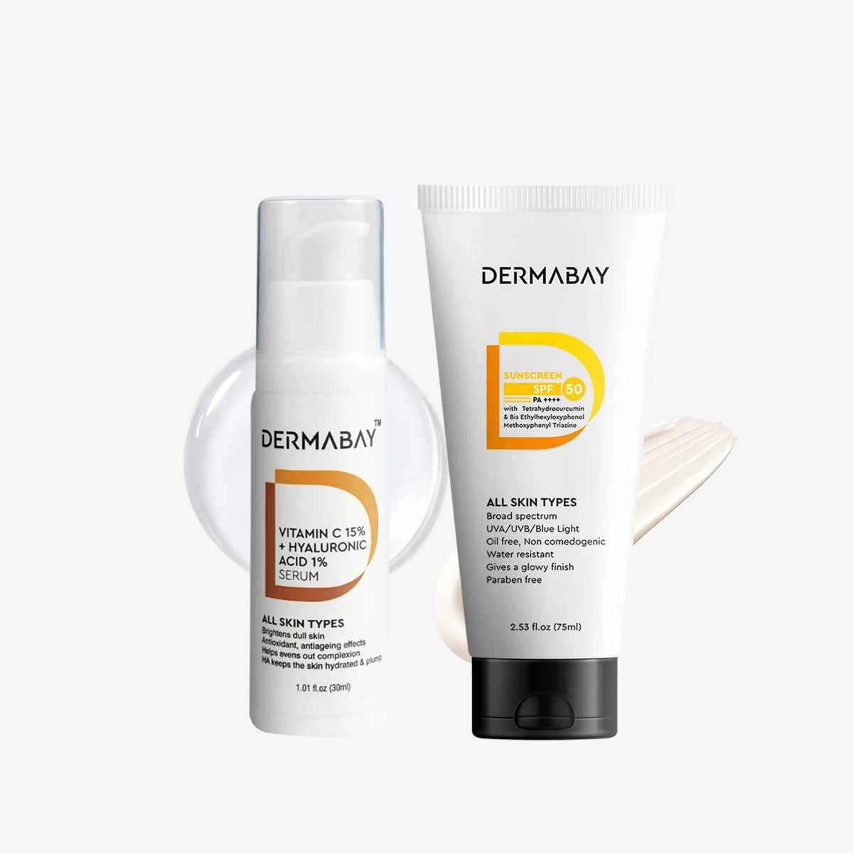 Flatlay product shot of the Dermabay Glow And Protect Combo featuring the Vitamin C 15% + Hyaluronic Acid 1% Serum and Sunscreen SPF 50 PA++++ with texture swatches.